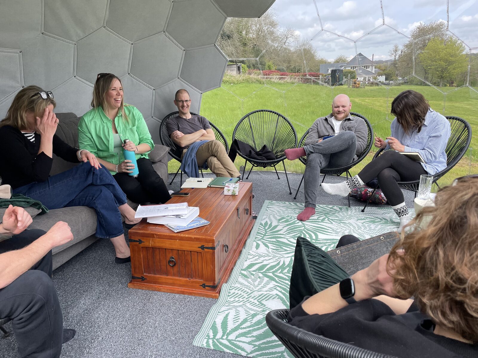 People gathered inside a geodesic dome on the site.